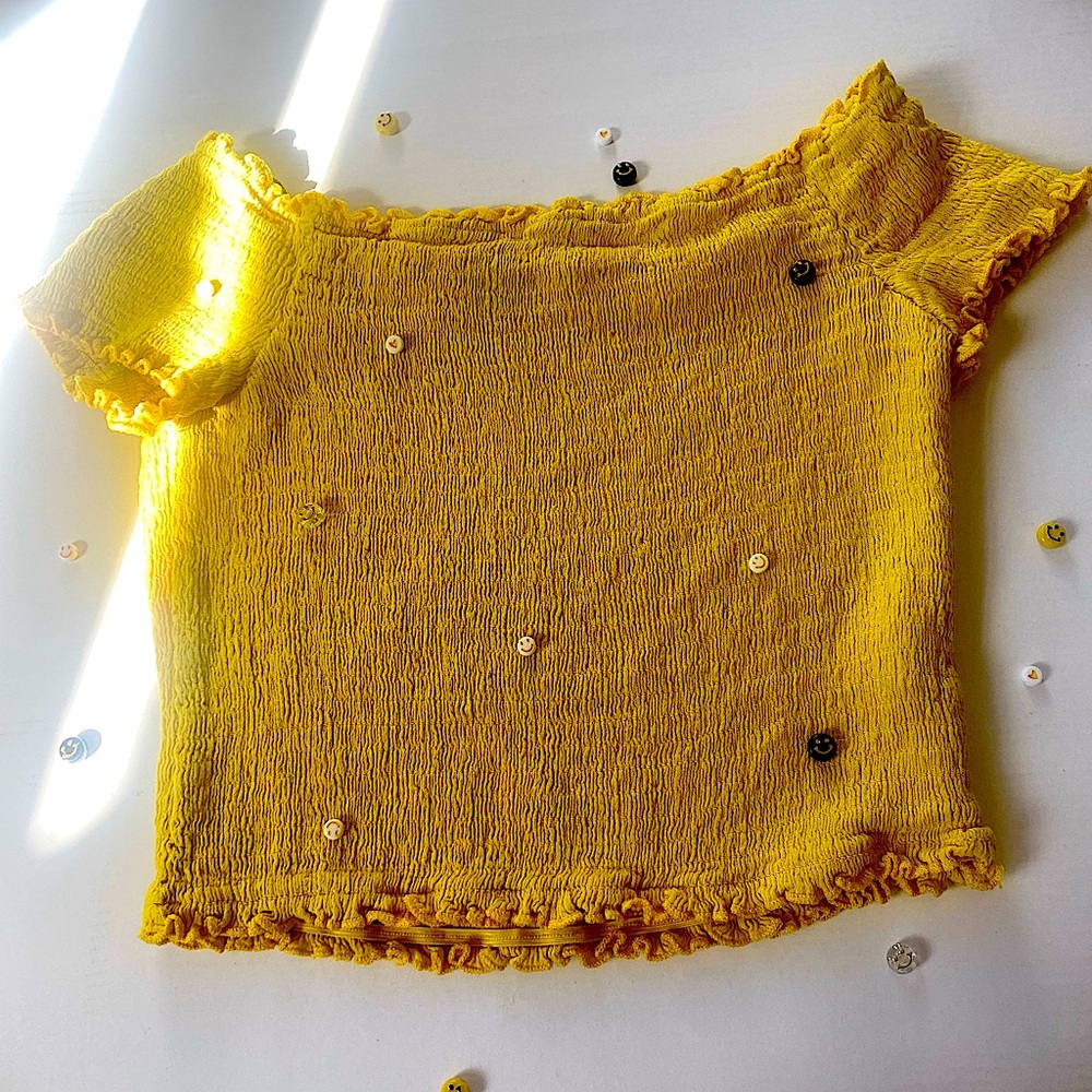 Yellow crop top.